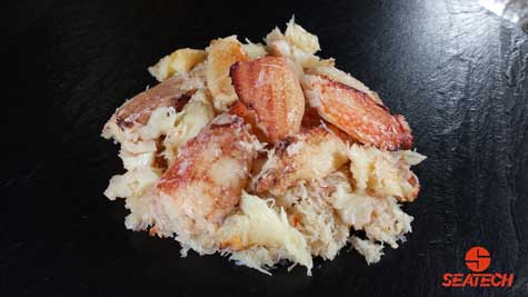 A photograph of Seatech rock crab meat with claw and leg meat over body meat.